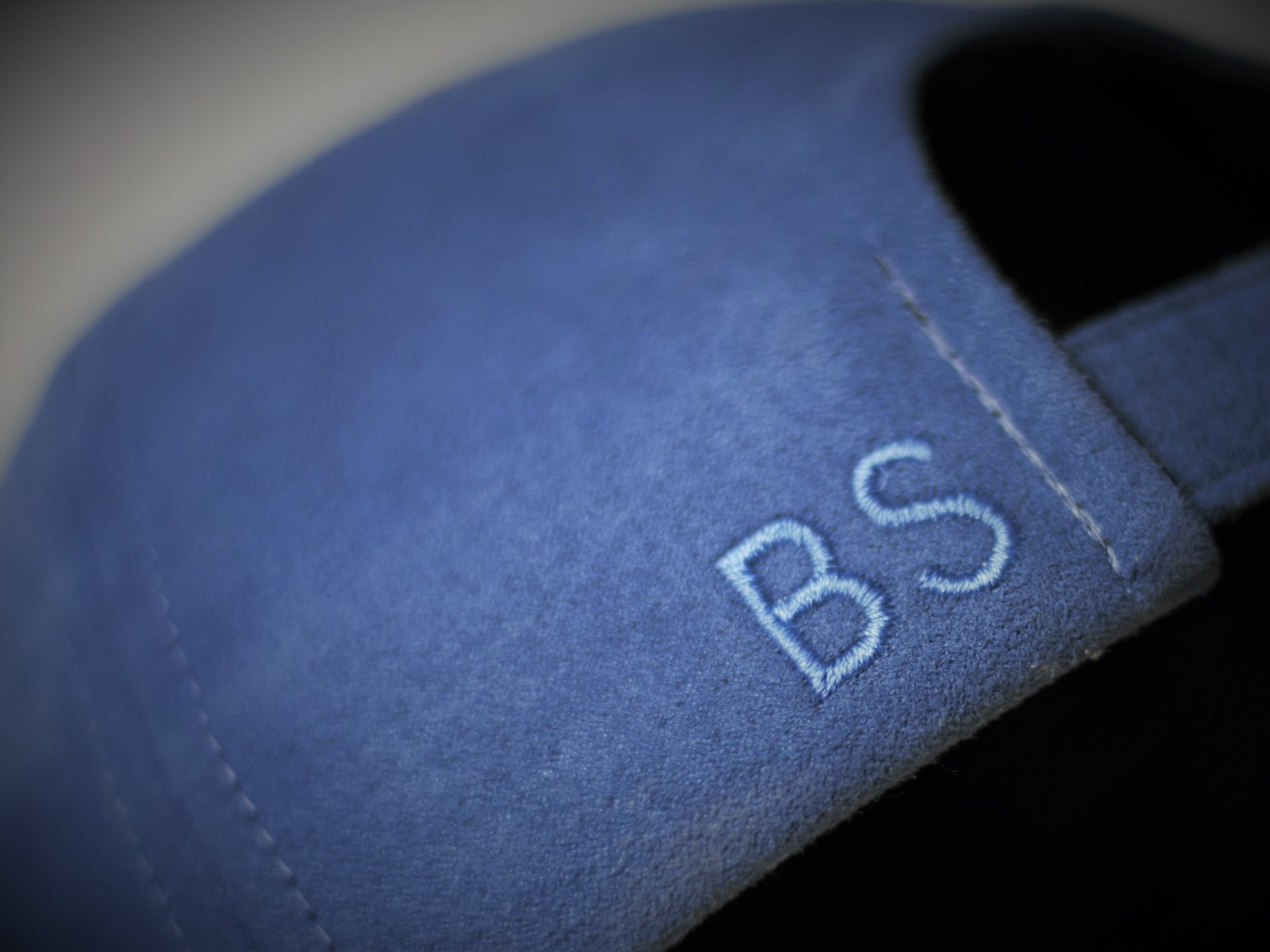 Personalised embroidery and branding on a custom cap strap